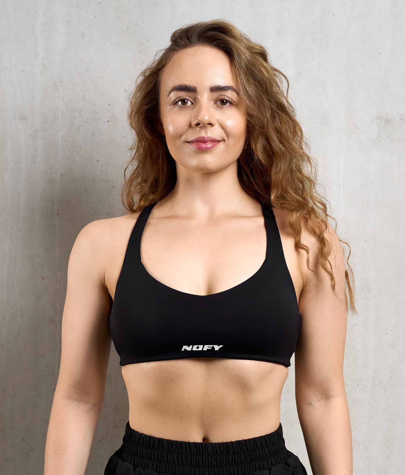 NOFY Sport-BH Damen Schwarz Steady, Frontansicht mit NOFY Logo